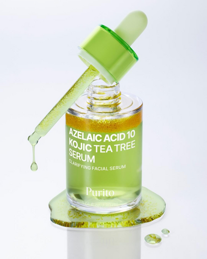 Frasco del Purito Azelaic Acid 10 Kojic Tea Tree Serum con el gotero levantado dejando caer gotas, sobre una charca de serum verde claro.